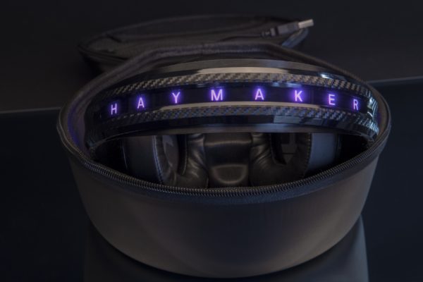 The Haymaker Headphones inside its case